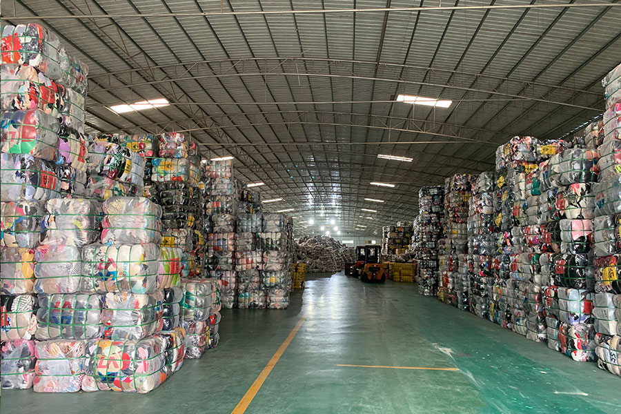 a hallway of Hissenshoes' warehouse showing stacks of used shoe bales