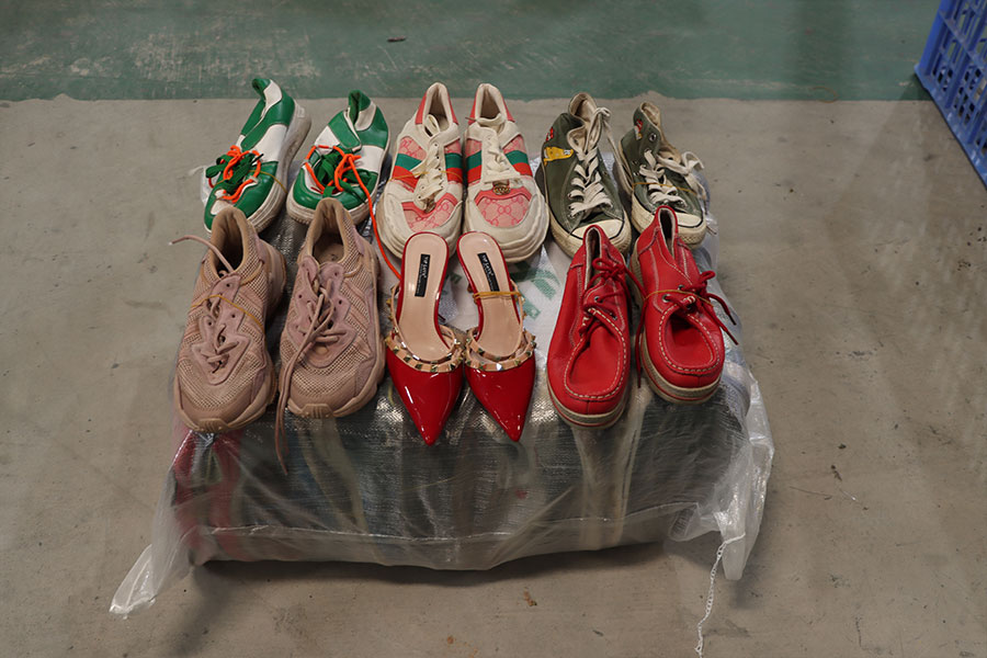 mixed assortment of used ladies shoes packed and sealed for shipment