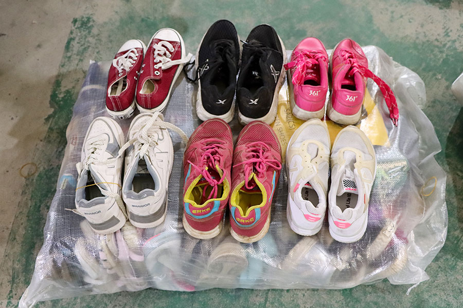 several pairs of Chinese-branded sneakers ready for shipping
