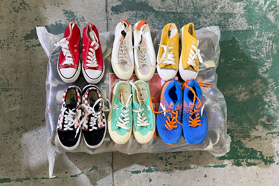 six pairs of branded used shoes on display for clients to see