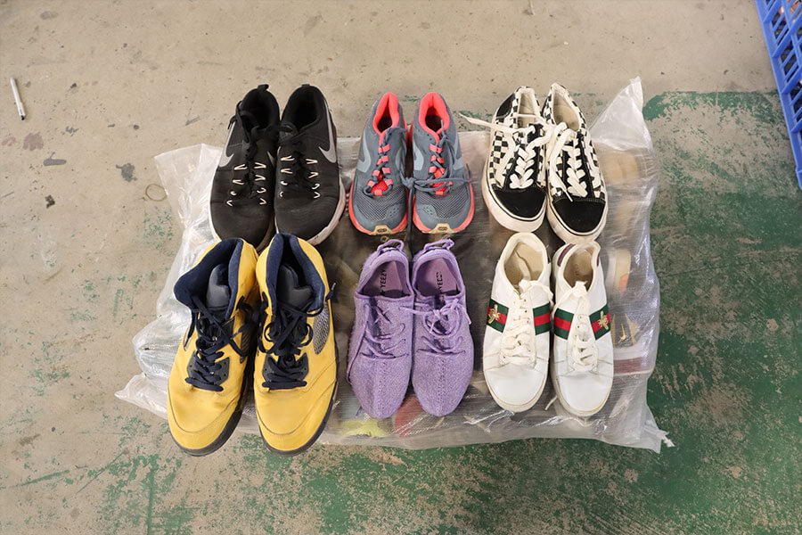 pairs of used sneakers on display to show customers our expert sorting prowess