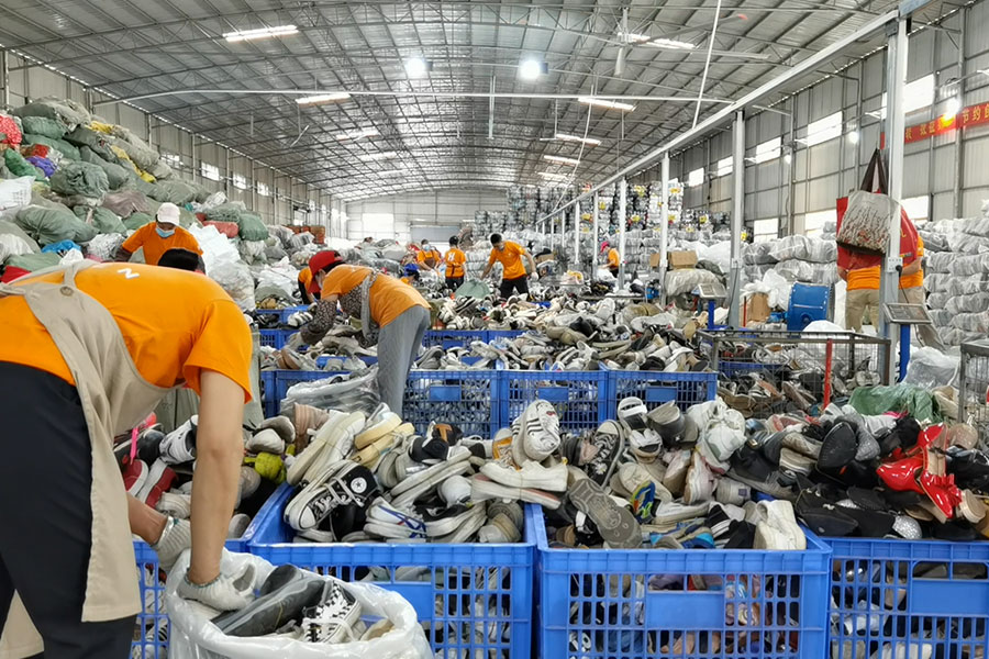 crates of used shoes for sorting at the hissenrags facility
